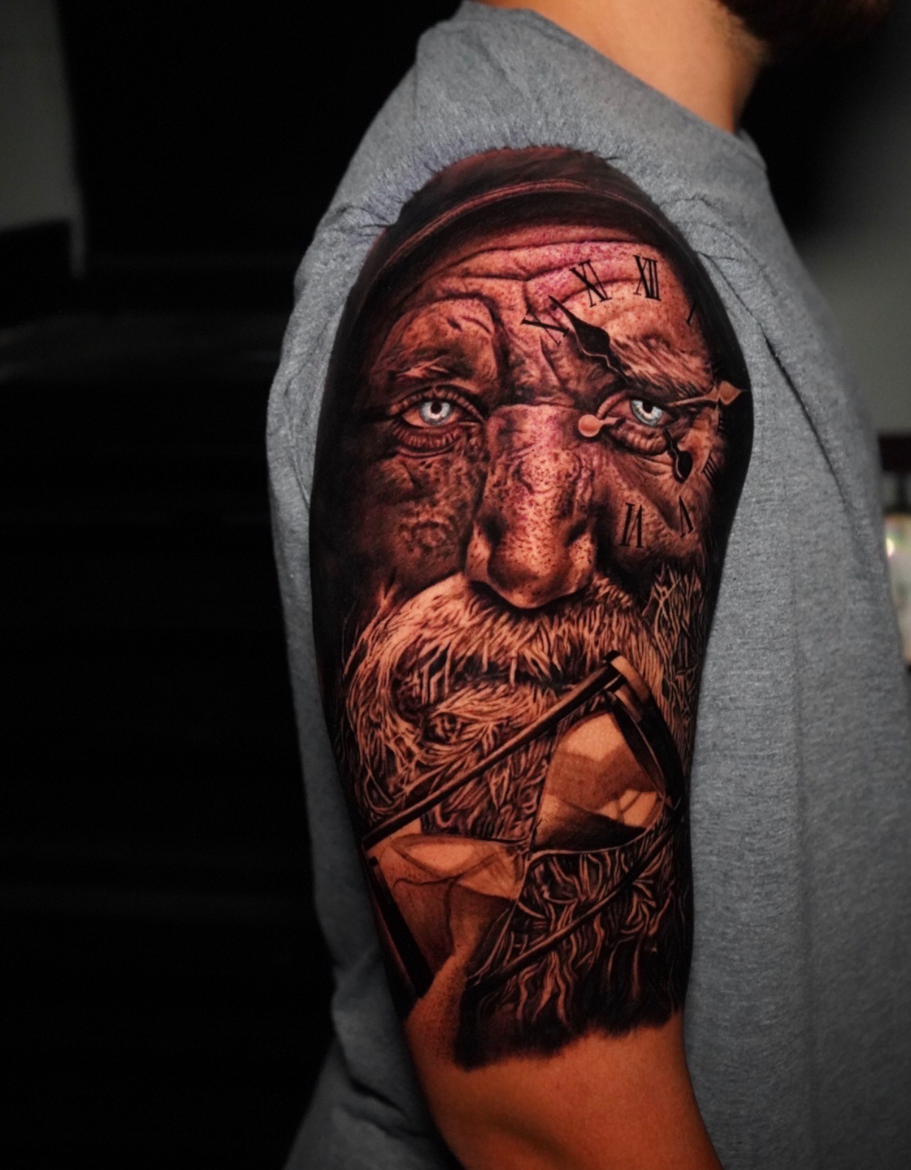 Realism tattoo of an older man with clock and hourglass