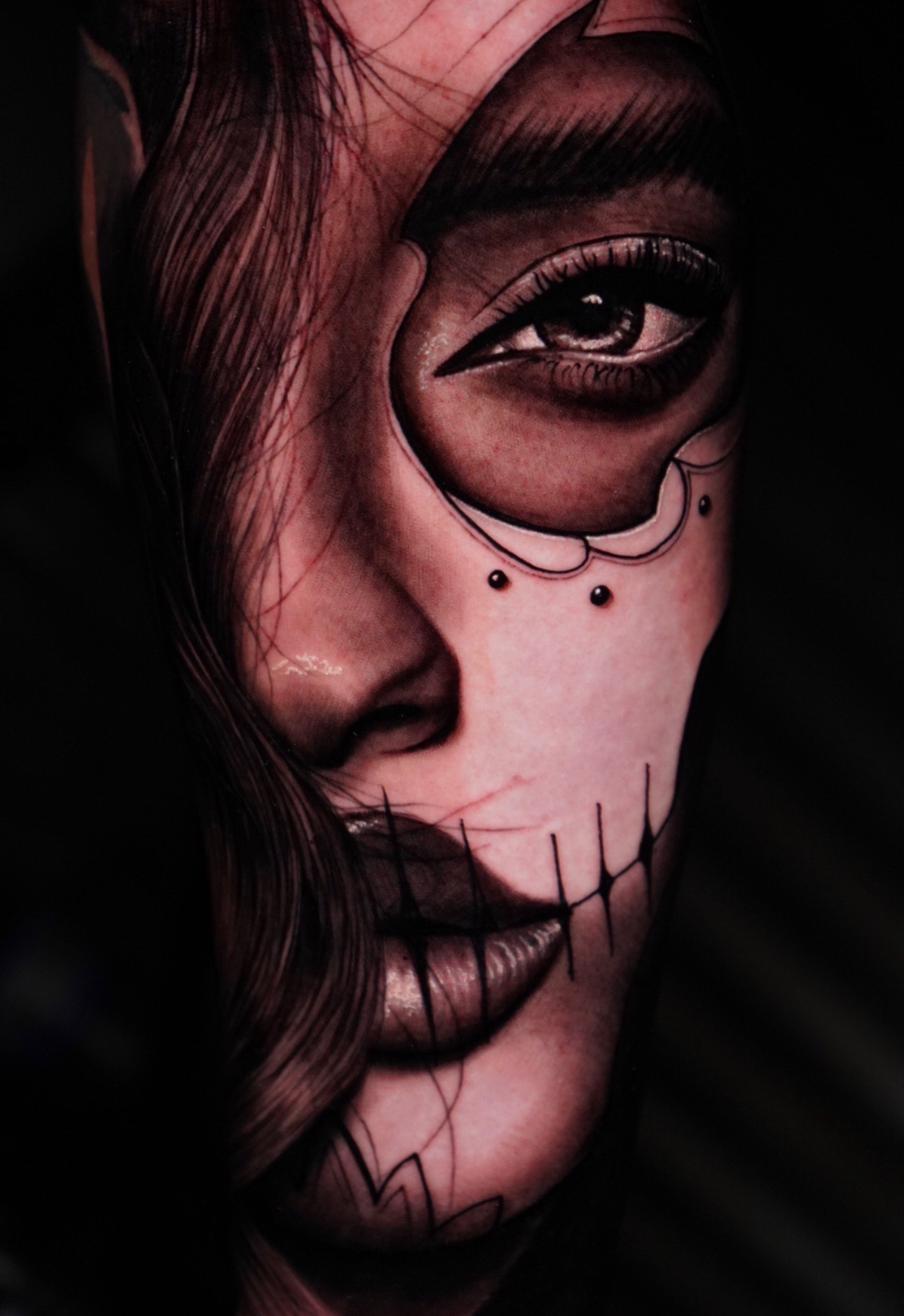 Realism tattoo of a stylized woman's face